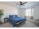 Bright bedroom with a comfortable bed, nightstand, and ceiling fan at 22862 E Bonanza Way, Queen Creek, AZ 85142