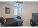 Cozy bedroom with a bed, ceiling fan, and large closet at 22862 E Bonanza Way, Queen Creek, AZ 85142