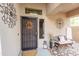 Inviting front porch with decorative accents and a comfortable bench at 23820 W La Canada Blvd, Buckeye, AZ 85396