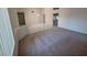 Open living room with tile and carpet flooring at 24809 S Drifter Dr, Sun Lakes, AZ 85248