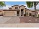 Two-story house with tan exterior, brown roof, and landscaped yard at 2731 W Shannon Ct, Chandler, AZ 85224