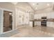 Eat-in kitchen with white cabinets, granite countertops, and sliding door to patio at 2731 W Shannon Ct, Chandler, AZ 85224