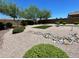 Landscaped backyard with artificial turf and rock features at 2816 W Pollack St, Phoenix, AZ 85041