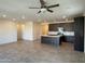 Open living room with tile floors and access to kitchen and backyard at 2816 W Pollack St, Phoenix, AZ 85041