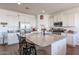 Modern kitchen with granite countertops, stainless steel appliances, and an island at 30080 W Fairmount Ave, Buckeye, AZ 85396