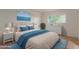 Bedroom with a dresser and blue bedding set at 3605 W Bethany Home Rd # 21, Phoenix, AZ 85019