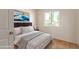 Bedroom with a bed and ocean-themed artwork at 3605 W Bethany Home Rd # 21, Phoenix, AZ 85019