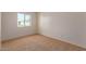 Bright bedroom with carpeted floor and a window at 3605 W Bethany Home Rd # 21, Phoenix, AZ 85019