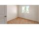 Simple bedroom with neutral carpet and large window at 3605 W Bethany Home Rd # 21, Phoenix, AZ 85019