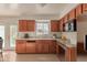 Kitchen with wood cabinets, tile backsplash, and stainless steel appliances at 3605 W Bethany Home Rd # 21, Phoenix, AZ 85019
