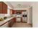 Updated kitchen with stainless steel appliances and wood cabinets at 3605 W Bethany Home Rd # 21, Phoenix, AZ 85019