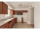 Simple kitchen with wood cabinets and tile floors at 3605 W Bethany Home Rd # 21, Phoenix, AZ 85019
