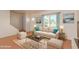 Living room with light beige sofa and coffee table at 3605 W Bethany Home Rd # 21, Phoenix, AZ 85019