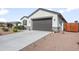 Front view of a single story home with a two-car garage at 36204 W San Sisto Ave, Maricopa, AZ 85138