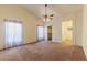 Spacious main bedroom with ceiling fan and ensuite access at 3971 N 151St Ln, Goodyear, AZ 85395