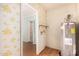 Laundry area with water heater and access to other rooms at 434 W Manhatton Dr, Tempe, AZ 85282