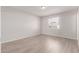 Bedroom with light grey walls and wood-look flooring at 4822 W Pinchot Ave, Phoenix, AZ 85031