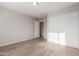 Spacious bedroom with mirrored closet and wood floor at 4822 W Pinchot Ave, Phoenix, AZ 85031