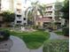 Landscaped courtyard with a tranquil fountain at 5104 N 32Nd St # 129, Phoenix, AZ 85018