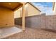 Small backyard with gravel, a block wall, and a covered patio at 5230 W Odeum Ln, Phoenix, AZ 85043