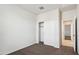 Bedroom with carpet flooring, a sliding door closet, and access to a hallway at 5440 E Rock Bush Ln, San Tan Valley, AZ 85140