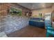 Indoor bar with brick feature wall and TV at 5524 N 3Rd Ave, Phoenix, AZ 85013