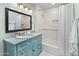 Charming bathroom with light teal vanity and hexagon tile floor at 5524 N 3Rd Ave, Phoenix, AZ 85013