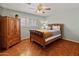 Charming bedroom with hardwood floors and wood furniture at 5524 N 3Rd Ave, Phoenix, AZ 85013