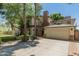 House exterior with a large driveway and mature trees at 5524 N 3Rd Ave, Phoenix, AZ 85013