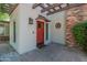 Charming red front door with a pergola and brick accents at 5524 N 3Rd Ave, Phoenix, AZ 85013