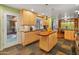 Open concept kitchen with island and access to backyard at 5524 N 3Rd Ave, Phoenix, AZ 85013