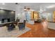 Bright living room with built-in shelving, hardwood floors and a fireplace at 5524 N 3Rd Ave, Phoenix, AZ 85013