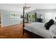 Main bedroom with hardwood floors, private access to a patio, and a king-size bed at 5524 N 3Rd Ave, Phoenix, AZ 85013