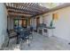 Outdoor patio with pergola, dining area, and built-in grill at 5524 N 3Rd Ave, Phoenix, AZ 85013
