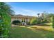 Landscaped backyard with lush lawn and mature trees at 5635 E Lincoln Dr # 8, Paradise Valley, AZ 85253