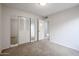 Bright bedroom with mirrored closet doors and carpet flooring at 7615 N 46Th Ave, Glendale, AZ 85301