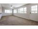 Living room with large windows and back door access at 7615 N 46Th Ave, Glendale, AZ 85301