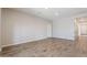 Spacious living room with neutral walls and wood-look tile floors at 8828 S 167Th Ln, Goodyear, AZ 85338