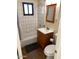 Clean bathroom with wood vanity, tiled shower/tub combo, and large mirror at 925 E Henry St, Tempe, AZ 85288