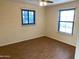 Spacious bedroom with tile floors and two large windows at 925 E Henry St, Tempe, AZ 85288