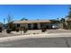 Front view of a charming single story home with well-maintained landscaping at 925 E Henry St, Tempe, AZ 85288