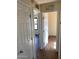 Hallway with wood-look tile floors and access to bedrooms at 925 E Henry St, Tempe, AZ 85288