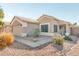 Single story home with a two car garage and desert landscaping at 9433 W Cinnabar Ave, Peoria, AZ 85345