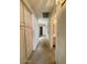 Long hallway with multiple doors and plush carpeting at 9808 W Rockwood Dr, Peoria, AZ 85382