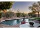 Relaxing pool area with patio furniture and beautiful desert landscaping at 10263 E Verbena Ln, Scottsdale, AZ 85255