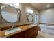 Bathroom with double vanity, granite countertops, and a large soaking tub at 1206 E Villa Rita Dr, Phoenix, AZ 85022