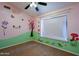 bedroom with whimsical wall decor and neutral carpeting at 1206 E Villa Rita Dr, Phoenix, AZ 85022