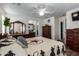 Bright bedroom featuring a comfortable bed, ceiling fan, and ample closet space at 12742 W Ash St, El Mirage, AZ 85335