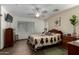 Well-lit bedroom with a queen-size bed and ample natural light from a large window at 12742 W Ash St, El Mirage, AZ 85335