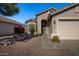 One-story house with a pink garage door and walkway to the entrance at 12742 W Ash St, El Mirage, AZ 85335